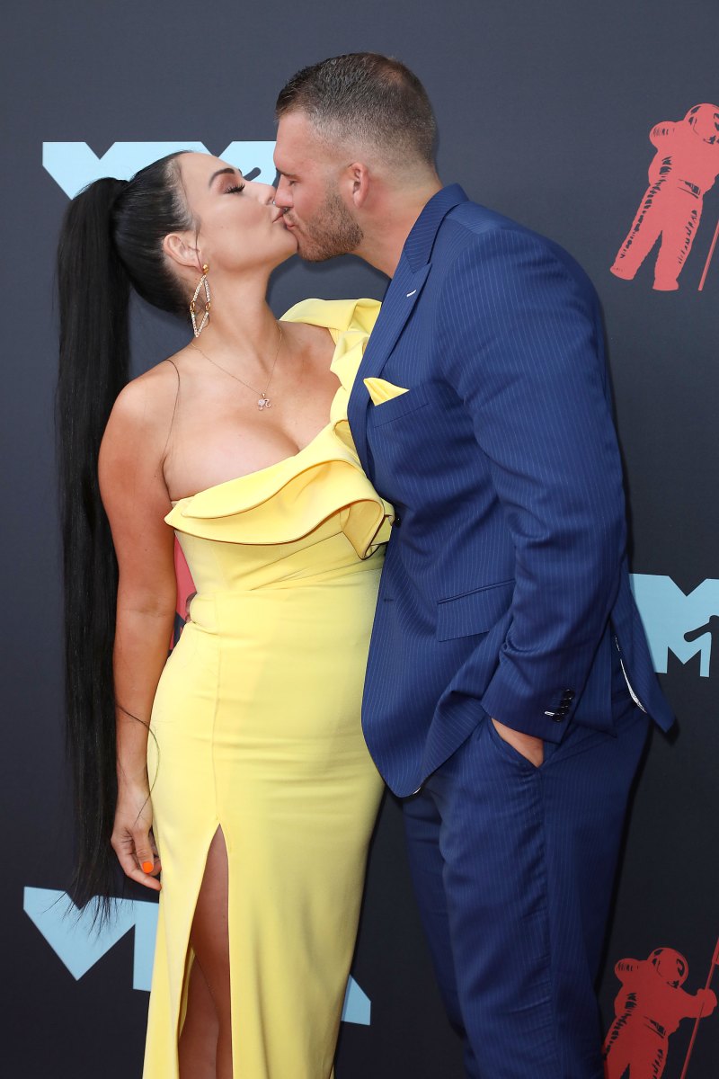 JWoww kissing her boyfriend in a yellow dress