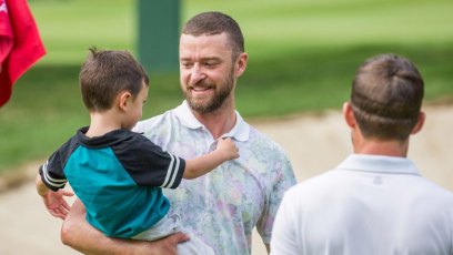 justin timberlake holds silas on golf course