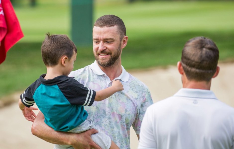 justin timberlake holds silas on golf course