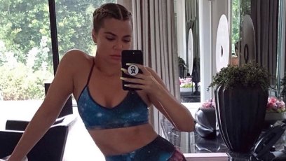 Khloe Kardashian Taking a Mirror Selfie in Workout Clothes