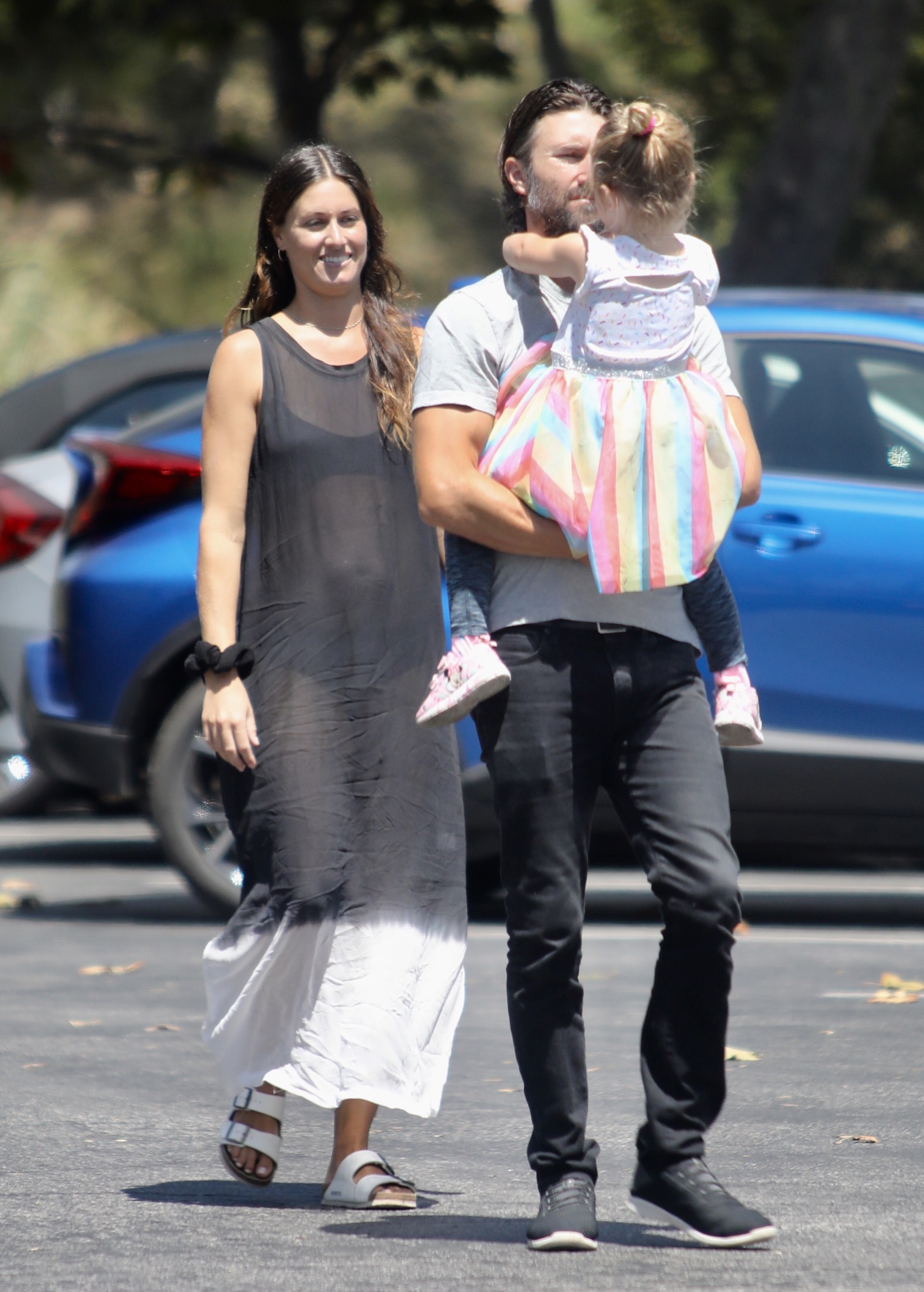 Brandon Jenner out running errands blue shirt and jeans with daughter Eva and pregnant Cayley Stoker in sheer dress