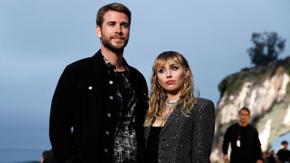 Miley Cyrus Wearing a Black Jacket With Liam Hemsworth on the Beach