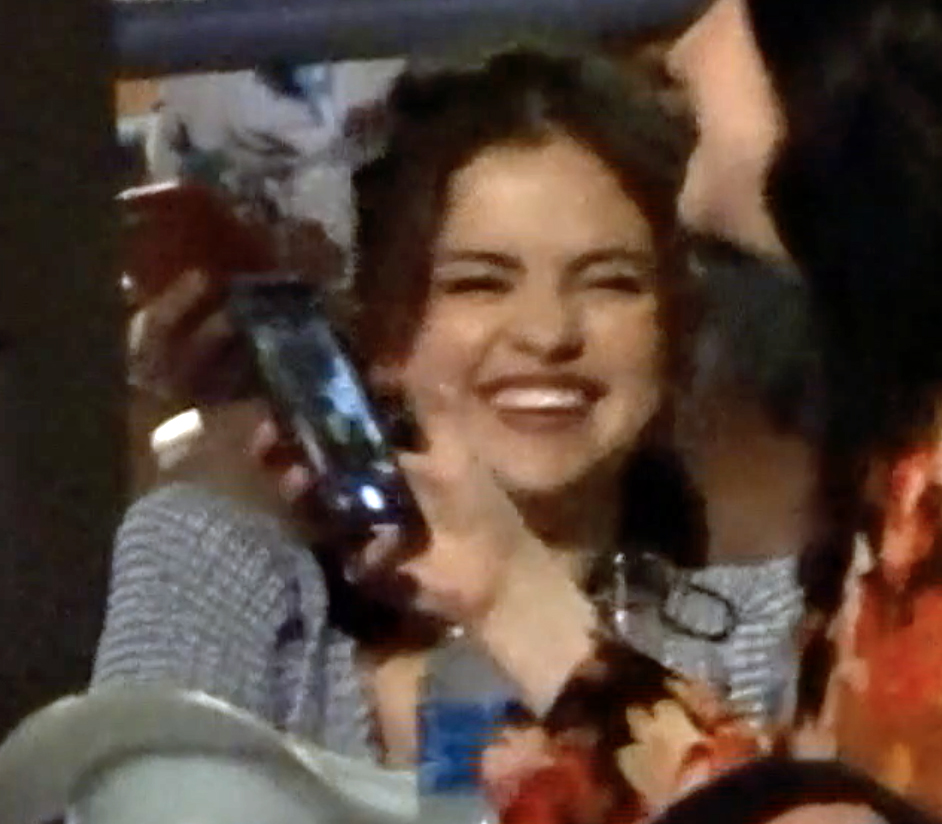 Selena Gomez smiling at a Kacey Musgraves concert
