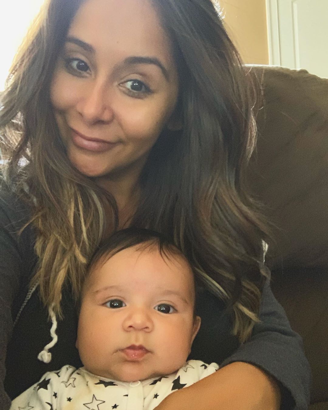 Nicole "Snooki" Polizzi taking a selfie with her son Angelo