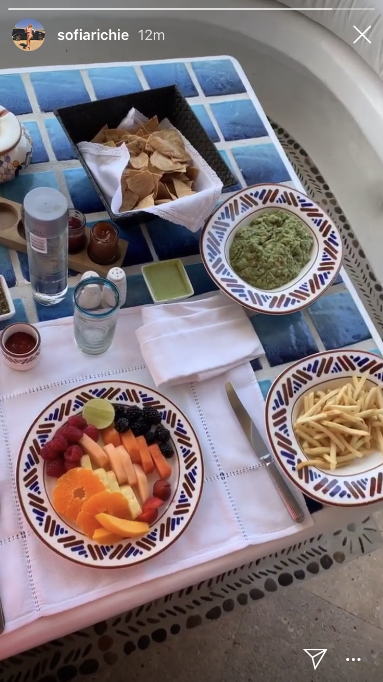 Sofia Richie's breakfast of fruit, french fries, guacamole and chips