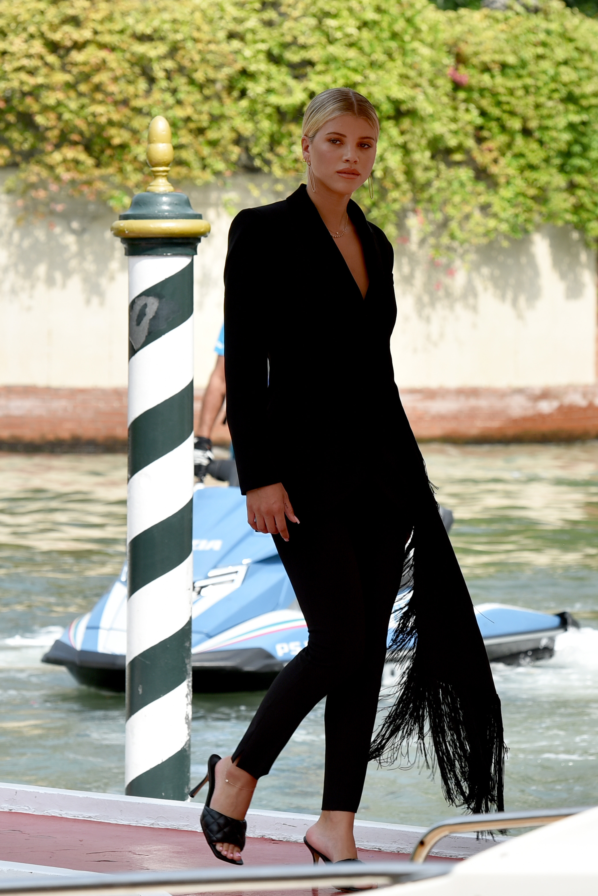 Sofia Richie wearing a black pantsuit at the Venice Film Festival