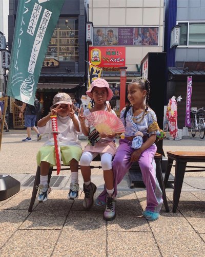 North West Ryan Romulus and Saint West on a Bench in Japan on Vacation With Kim Kardashian and Kanye West