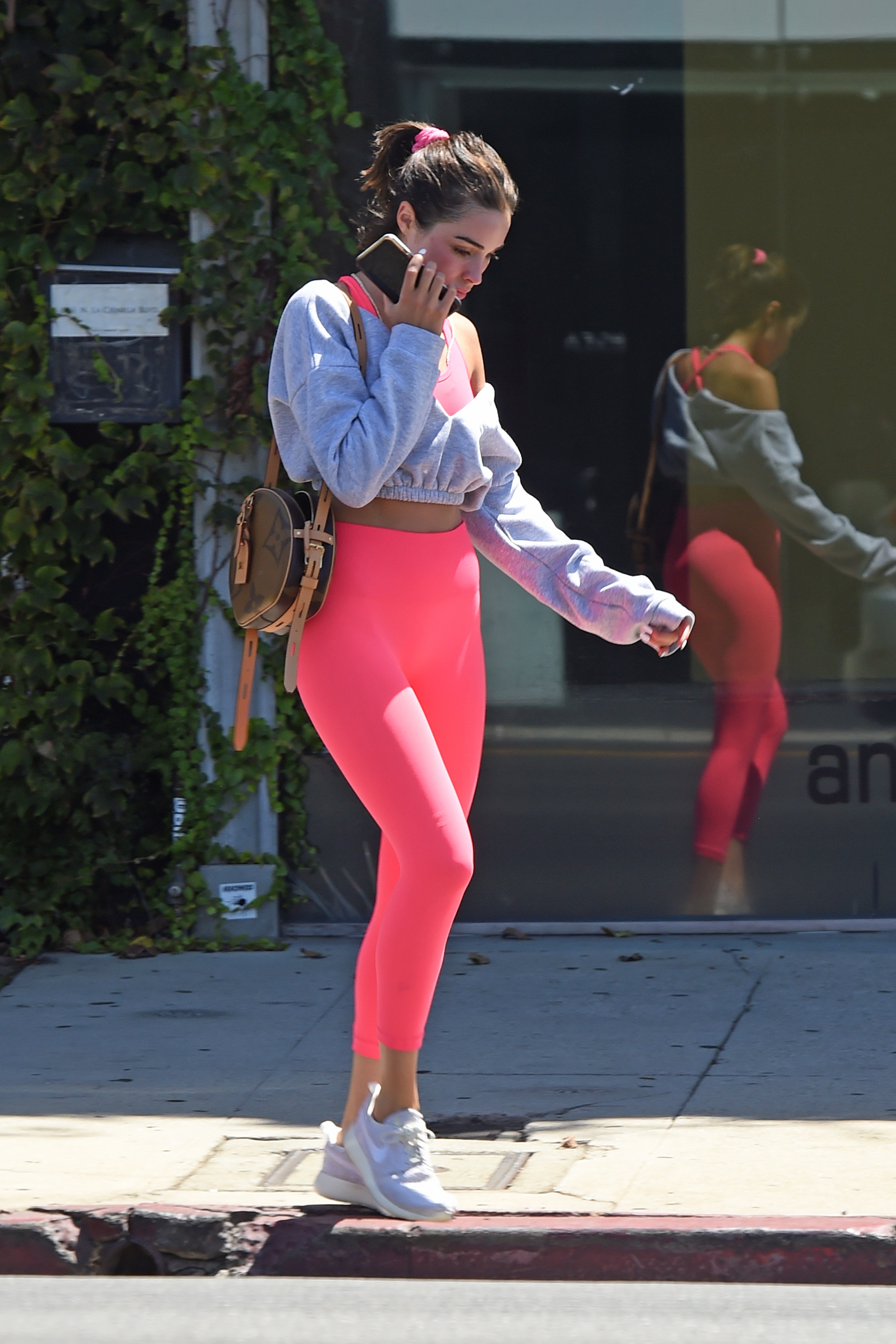 Olivia Culpo in a Crop Top and Hot Pink Leggings