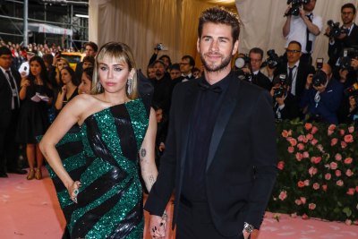 Miley Cyrus and Liam Hemsworth Smile and Hold Hands at the Met Gala