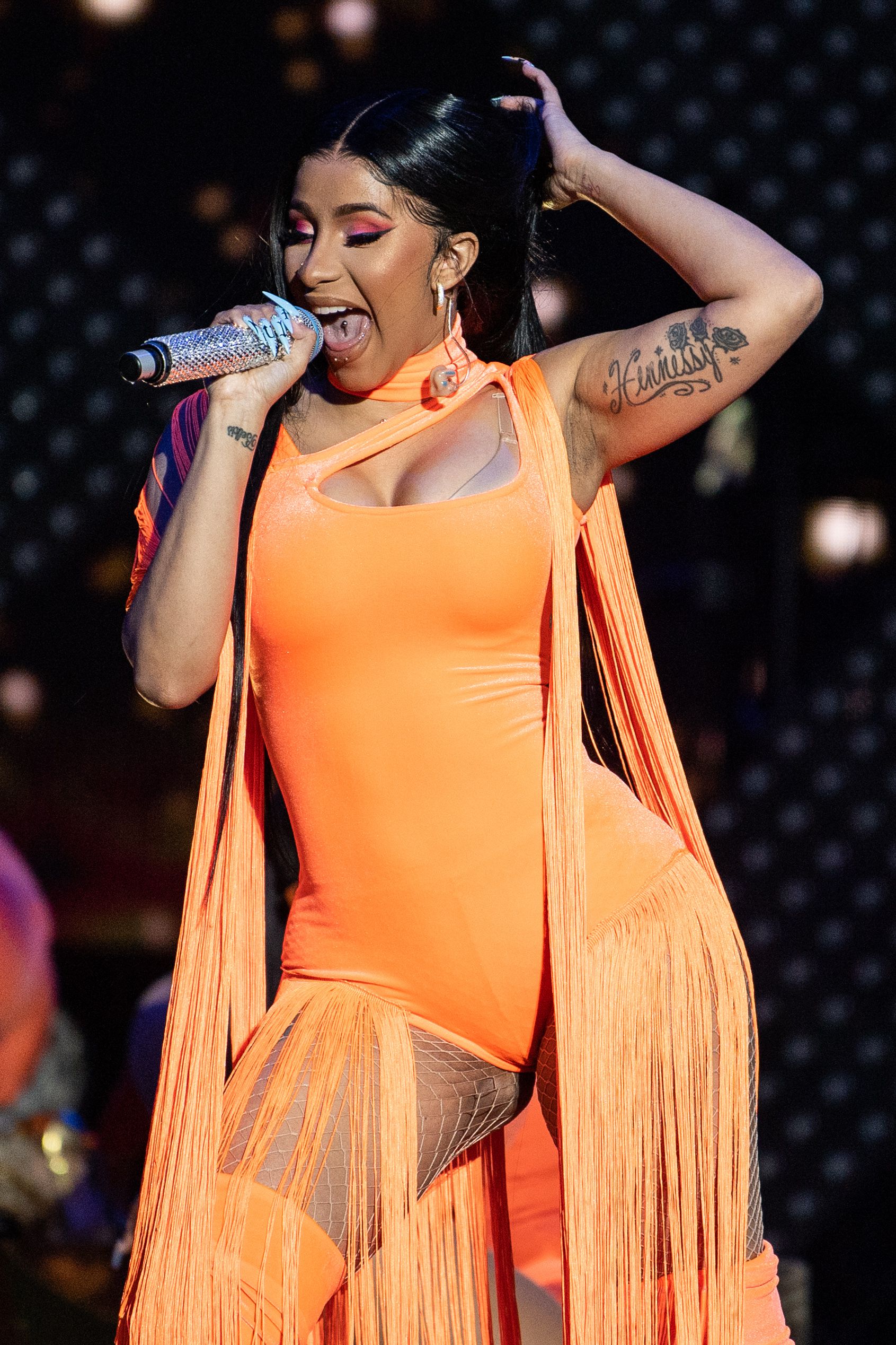 Cardi B Orange Costume on Stage Performance