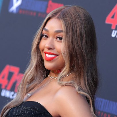 Jordyn Woods Close Up on 47 Meters Down Red Carpet Red Lipstick and Black Dress