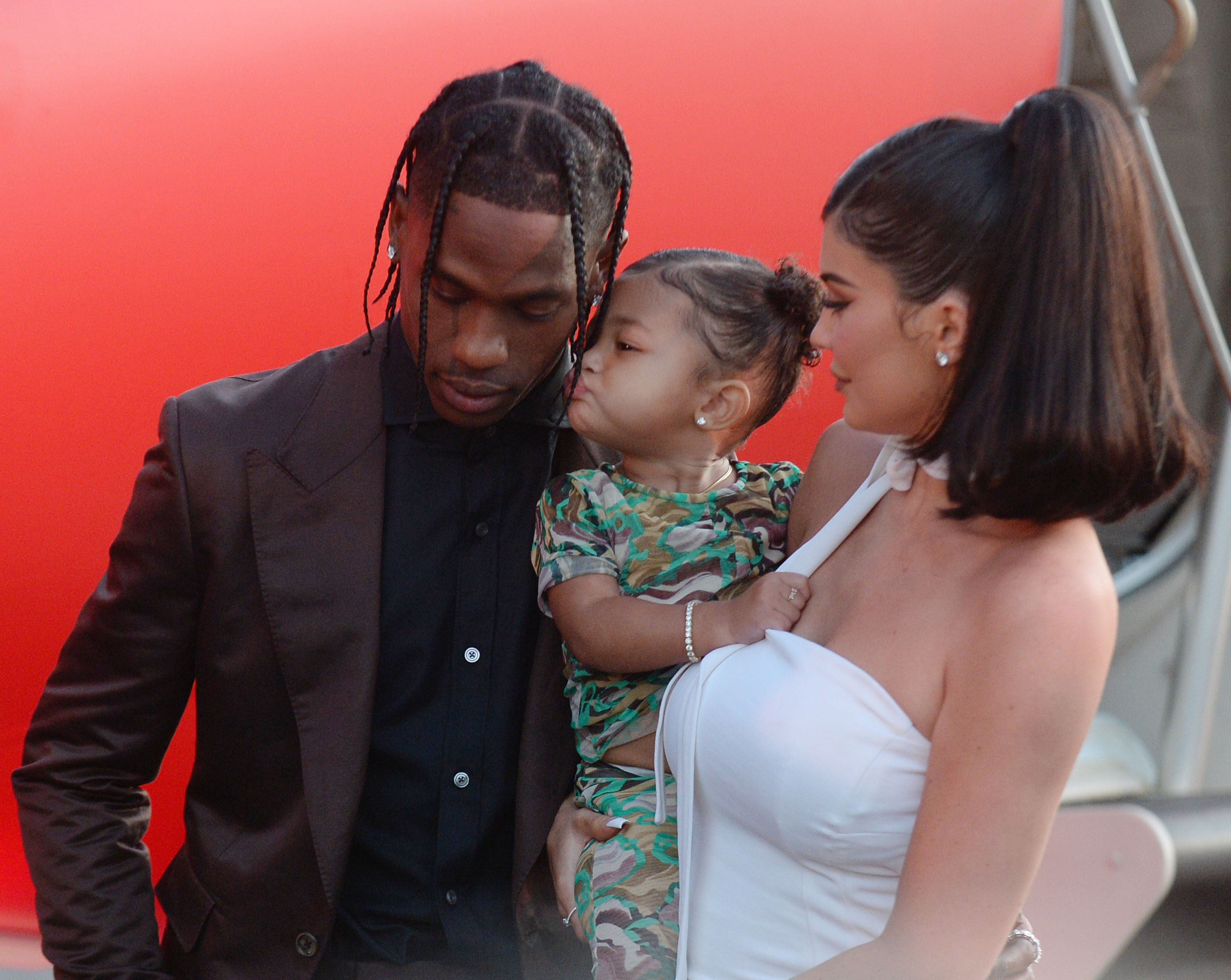 Kylie Jenner Holds Stormi Webster With Travis Scott on Red Carpet