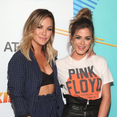 Becca Tilley Wearing a Blue Outfit With JoJo Fletcher in a Pink Floyd Shirt