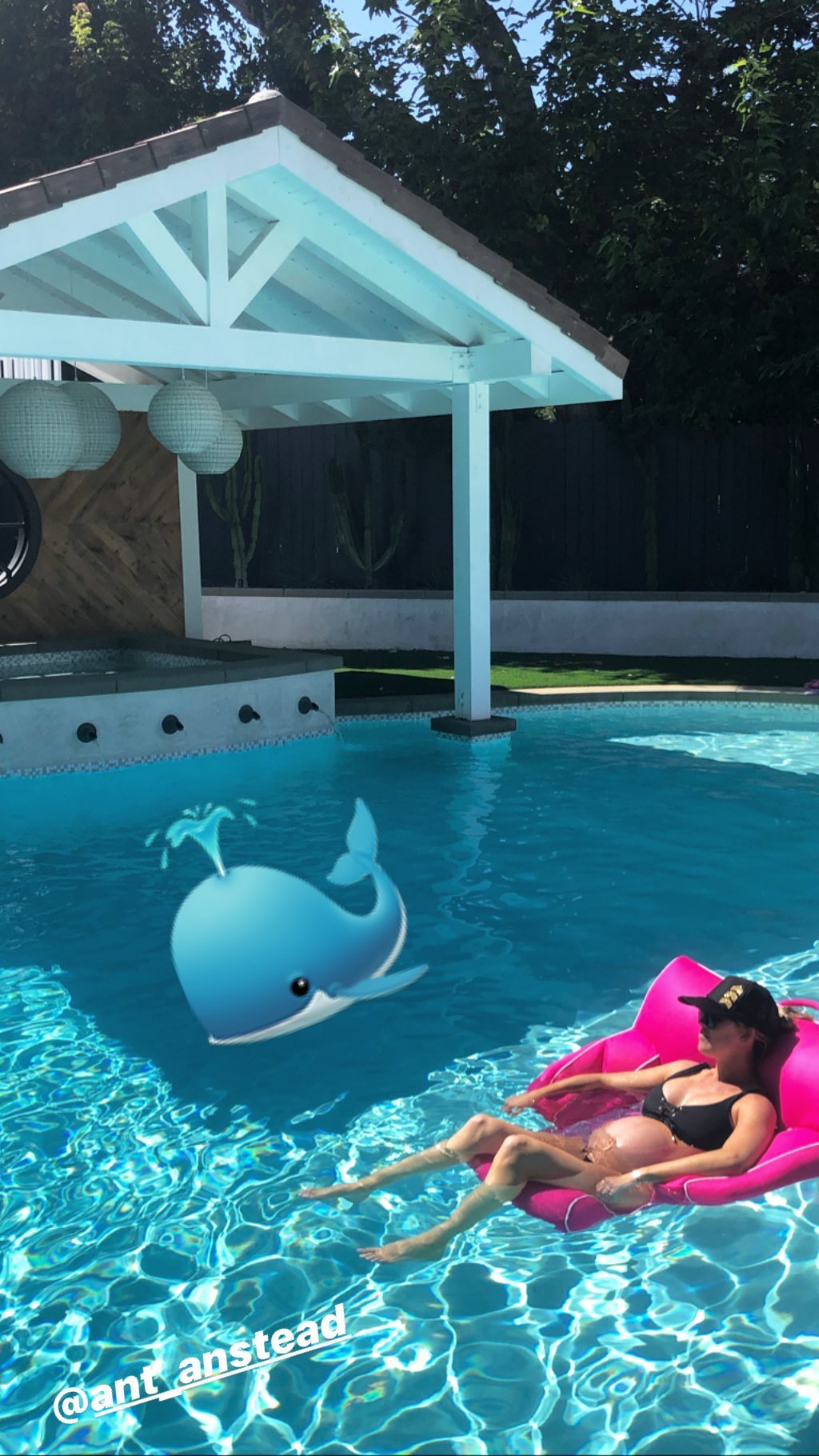 Christina Anstead Wearing a Black Bikini in a Pool