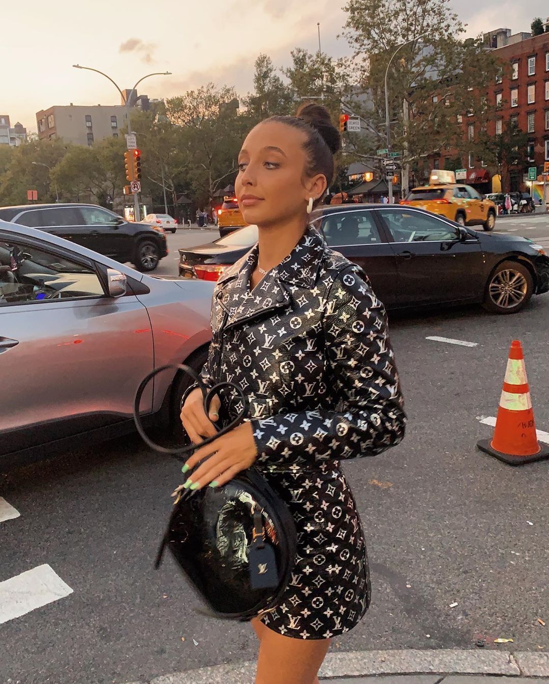 Emma Chamberlain posing on a NYC street during NYFW
