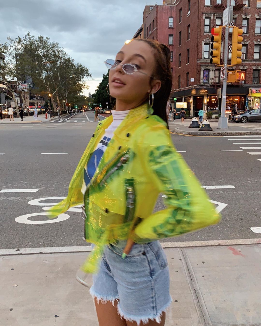 Emma Chamberlain posing on a NYC street during NYFW