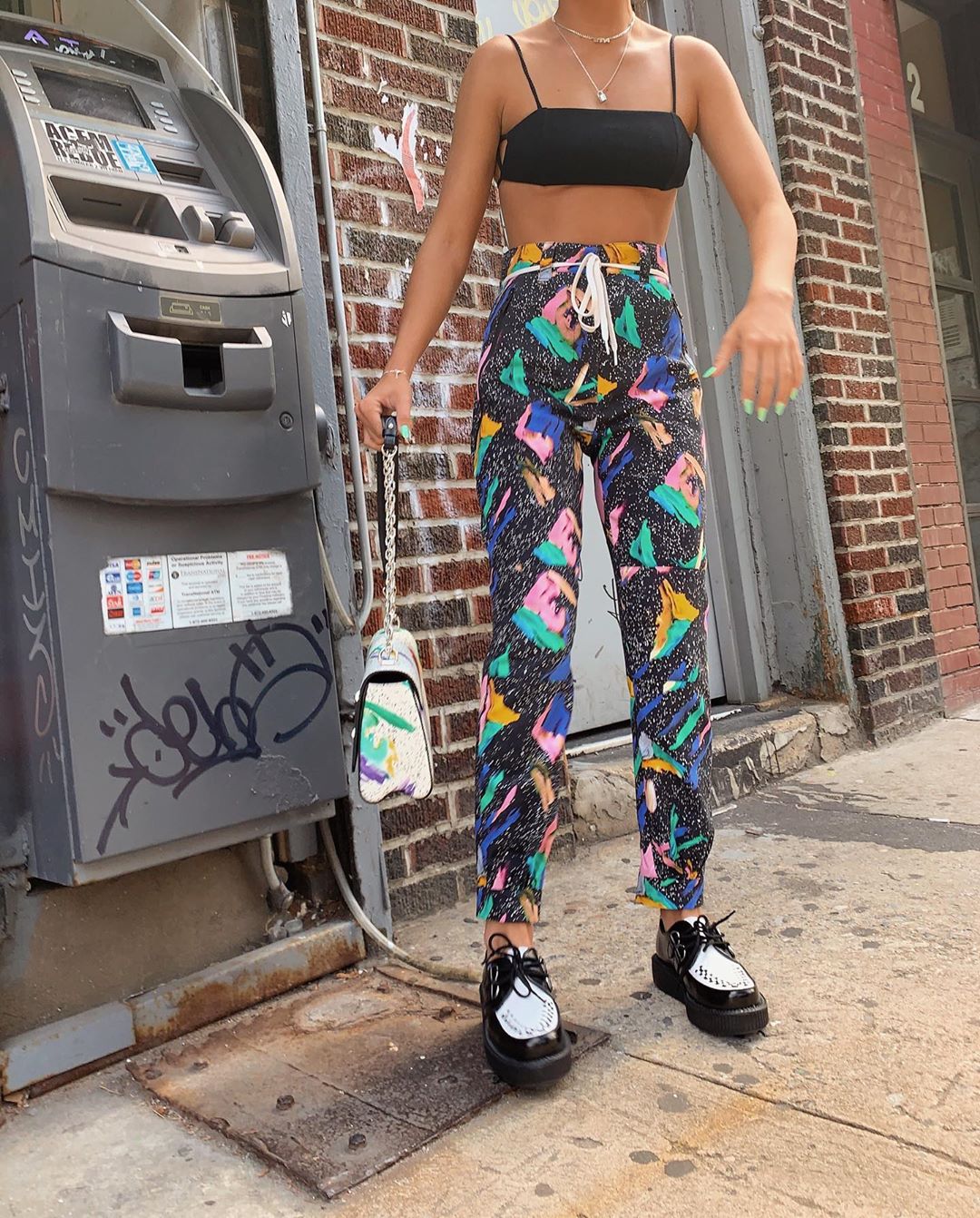 Emma Chamberlain posing on a NYC street during NYFW