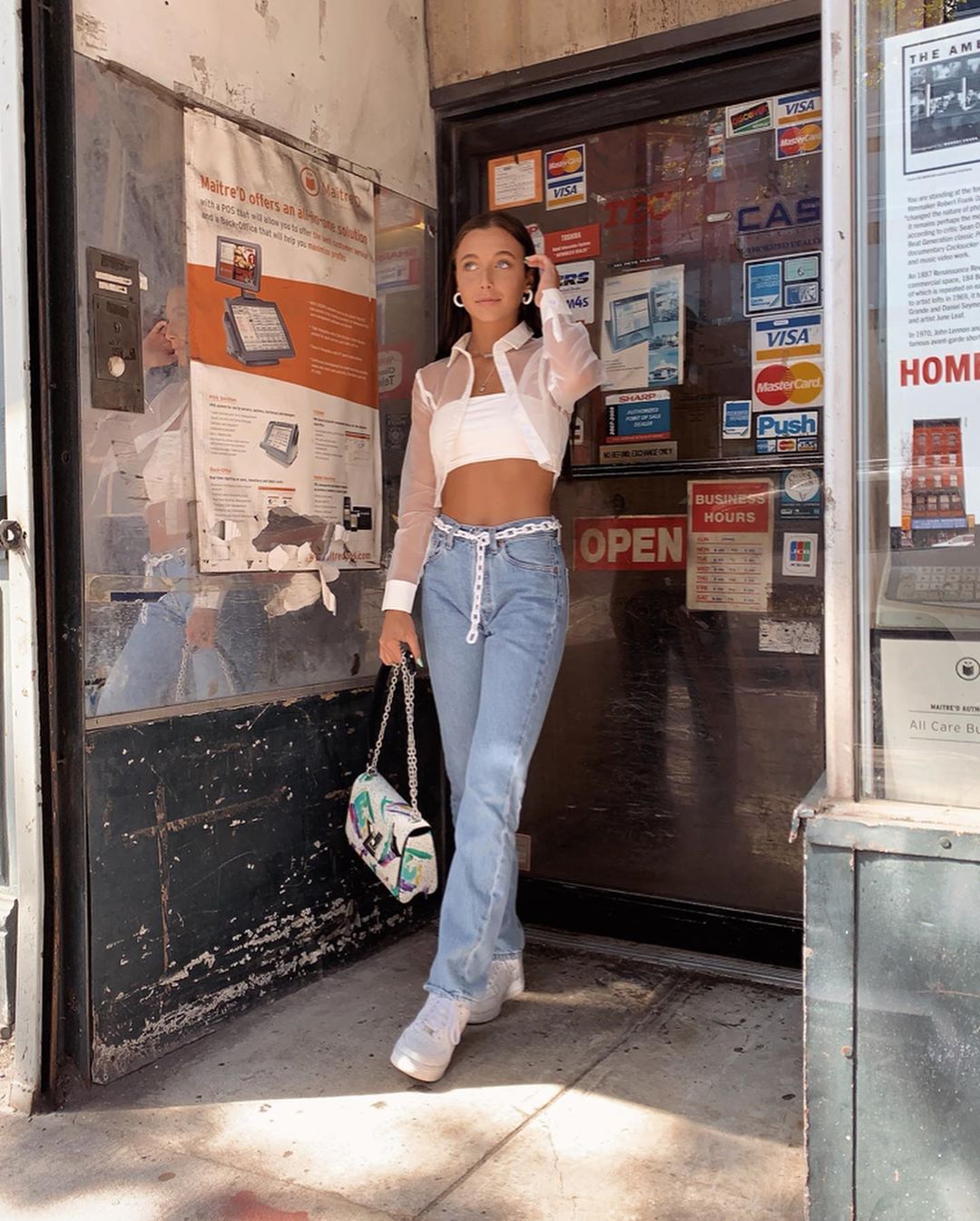 Emma Chamberlain posing on a NYC street during NYFW