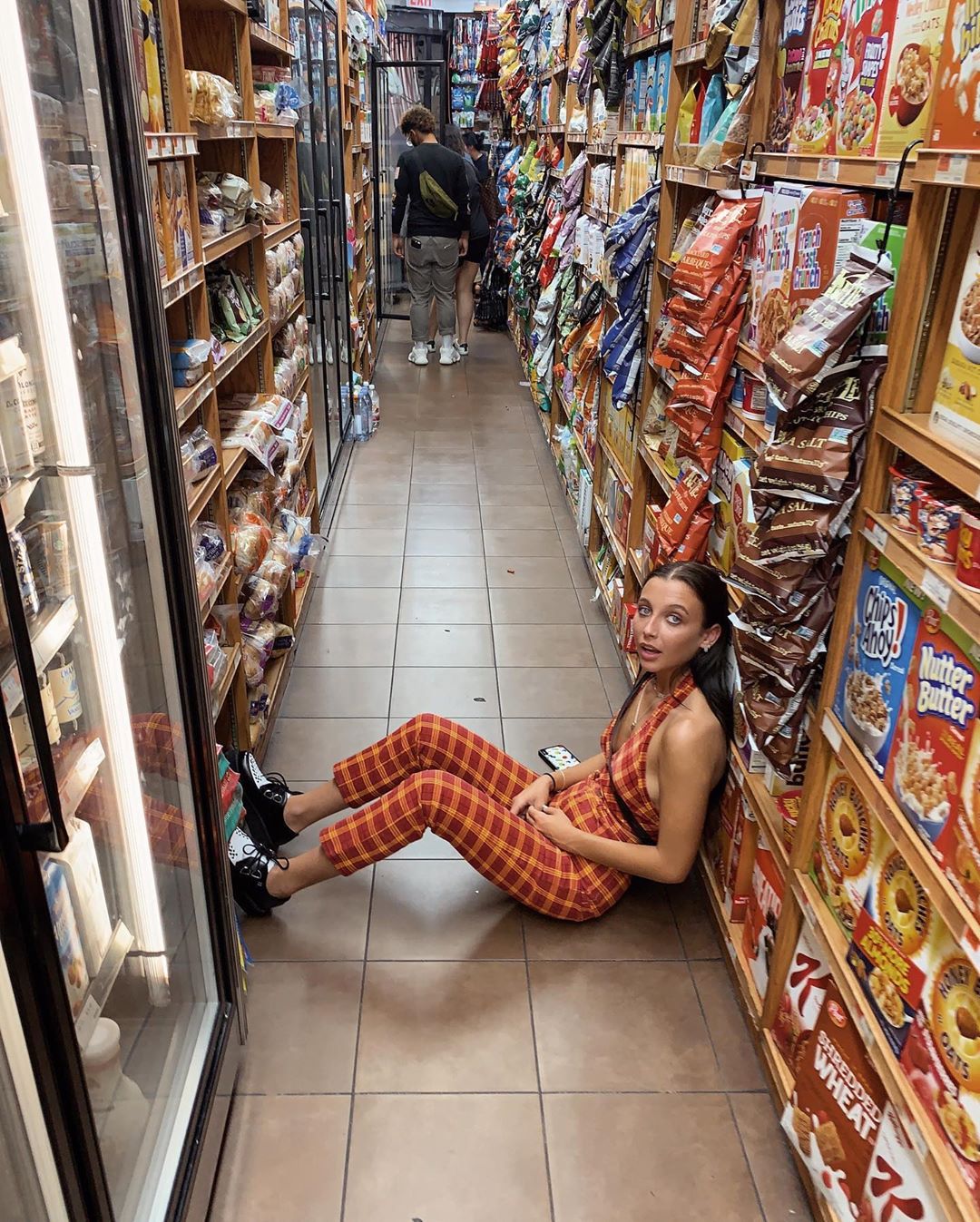 Emma Chamberlain posing on a NYC street during NYFW