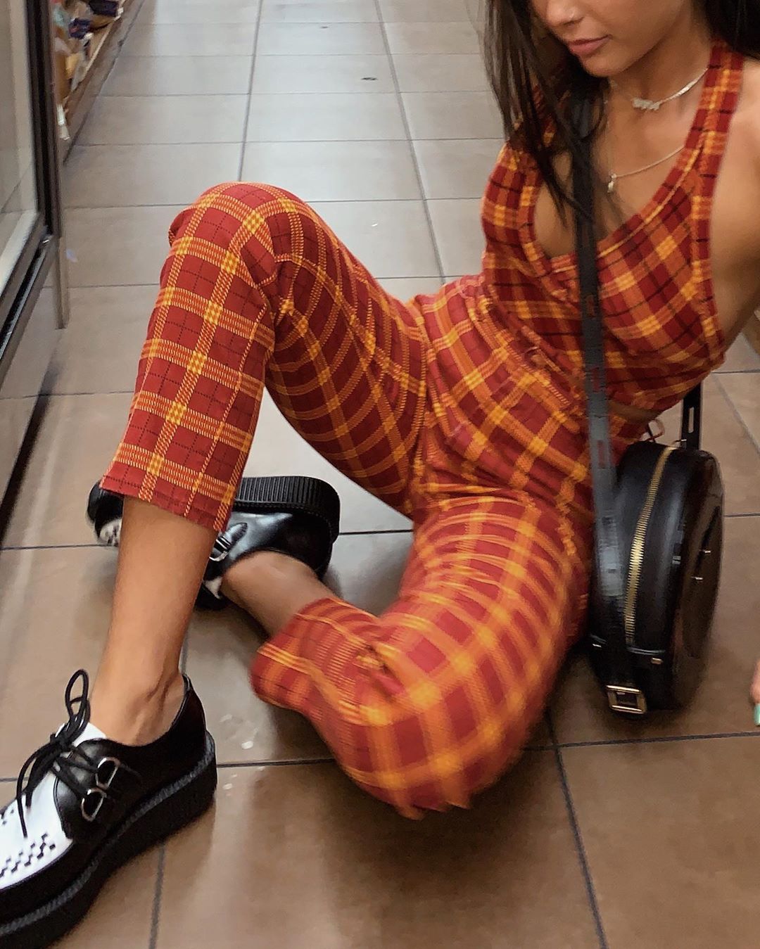 Emma Chamberlain posing on a NYC street during NYFW