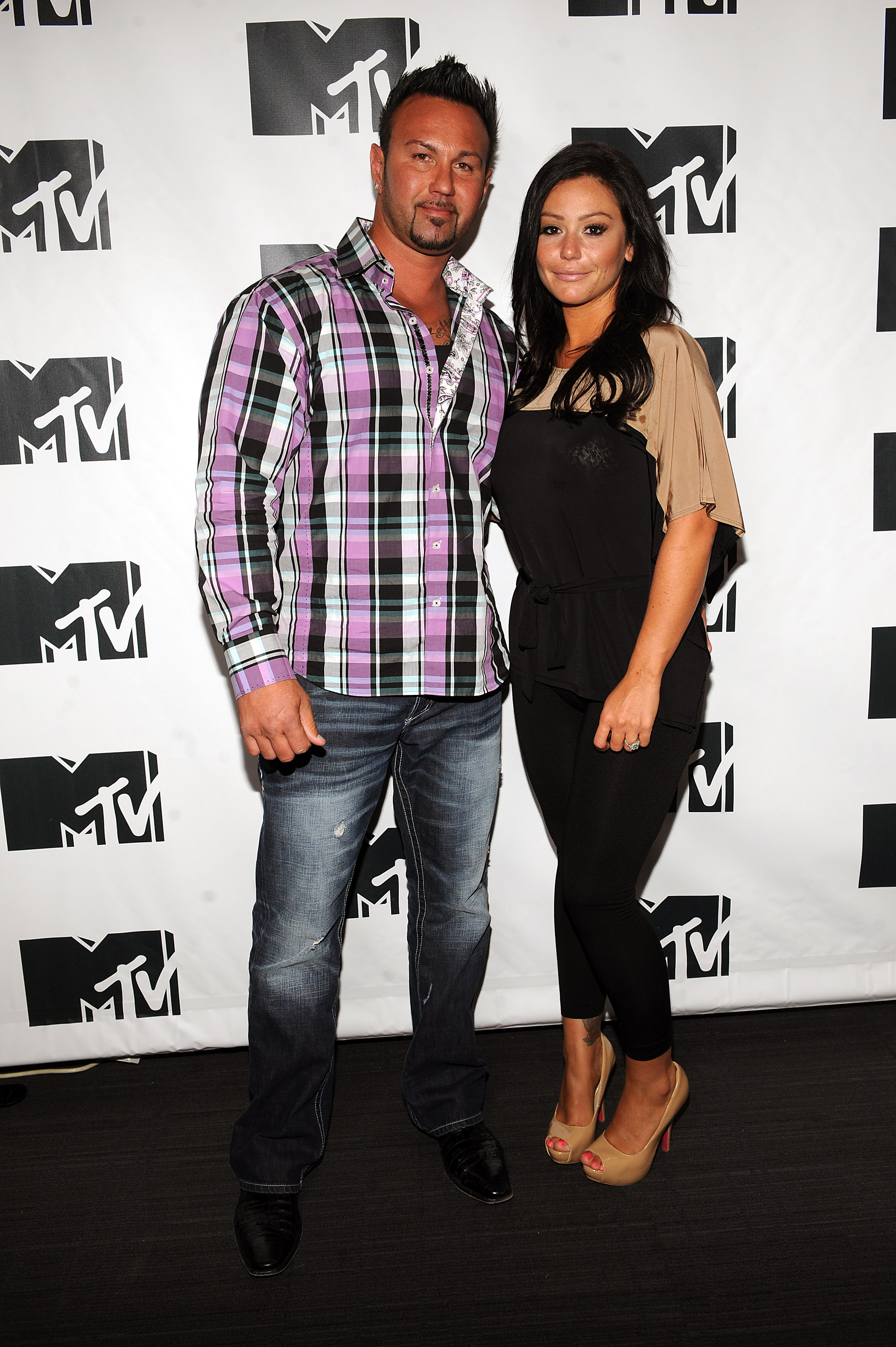 Jenni "JWoww" Farley posing with now-ex-husband Roger Mathews