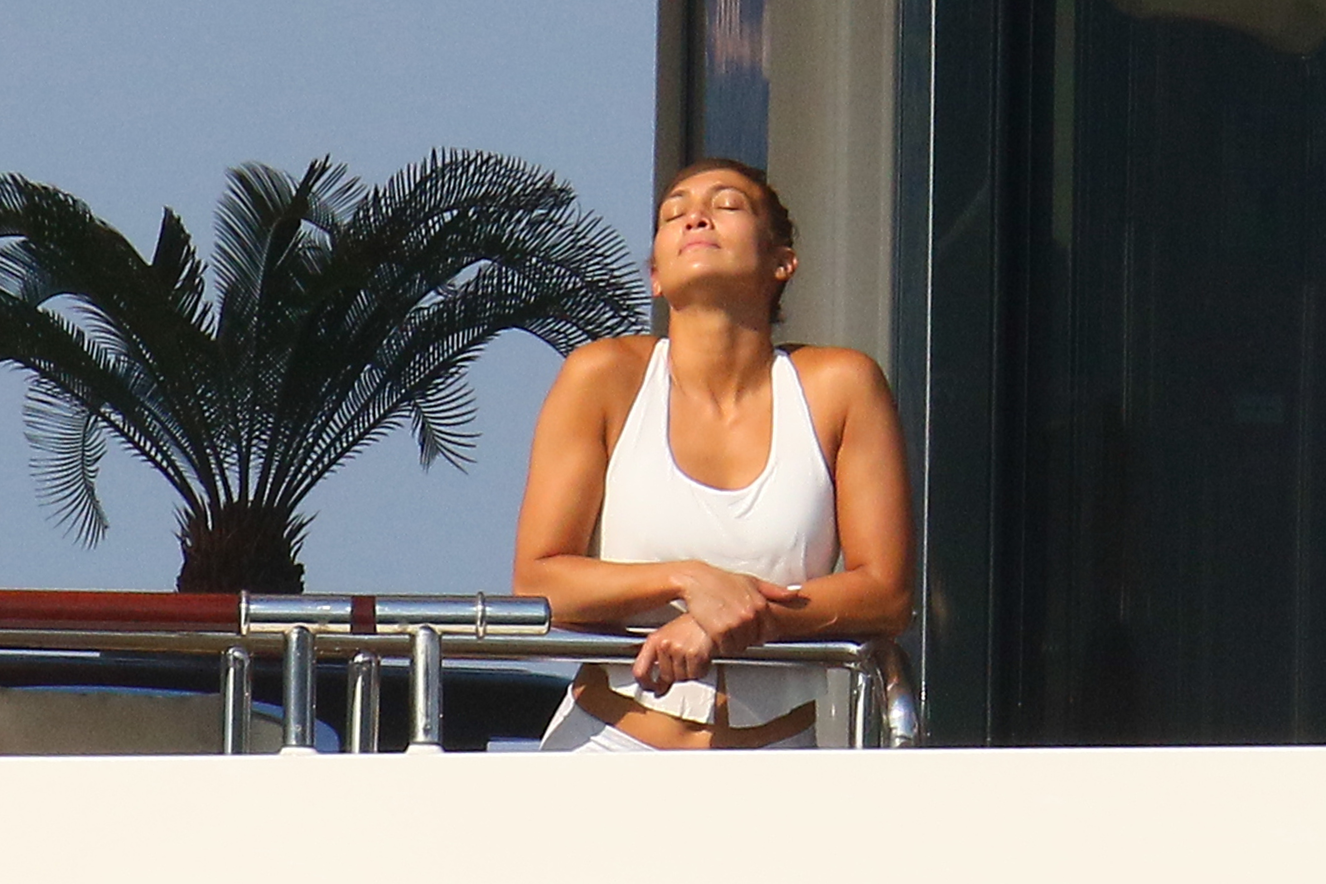 Jennifer Lopez works out while onboard a luxury yacht in the South of France