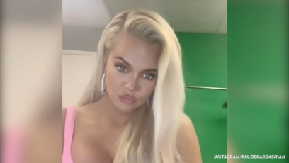 Khloe Kardashian wearing a pink corset with blonde hair