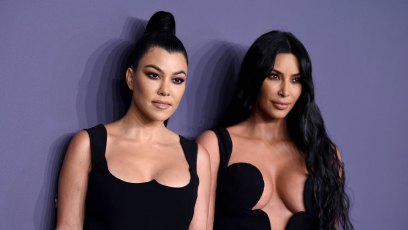 Kourtney and Kim Kardashian at the amfAR GALA