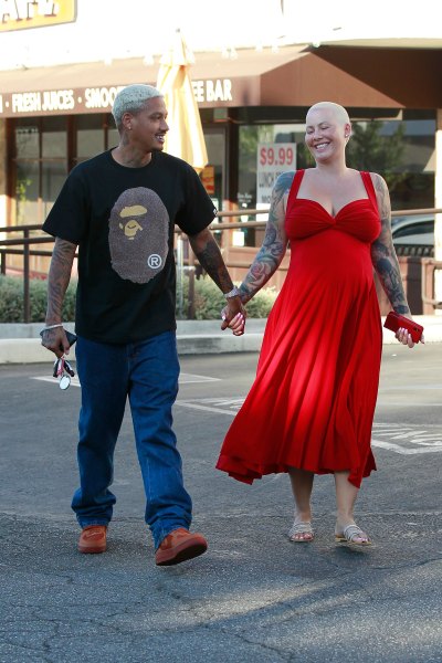 Pregnant Amber Rose Laughs With Alexander Edwards While Holding Hands