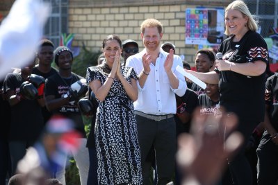 Duke and Duchess of Sussex tour of Africa Clapping and Smiling Meghan Markle and Prince Harry