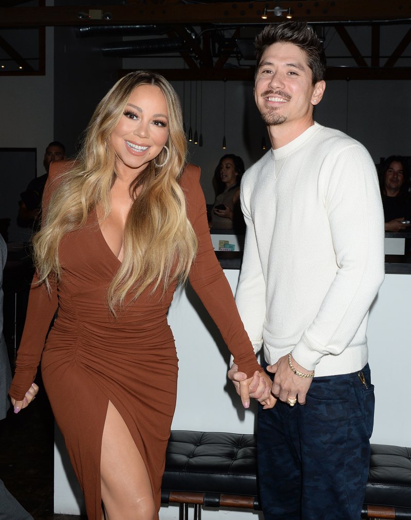 Mariah Carey and Bryan Tanaka smiling and holding hands