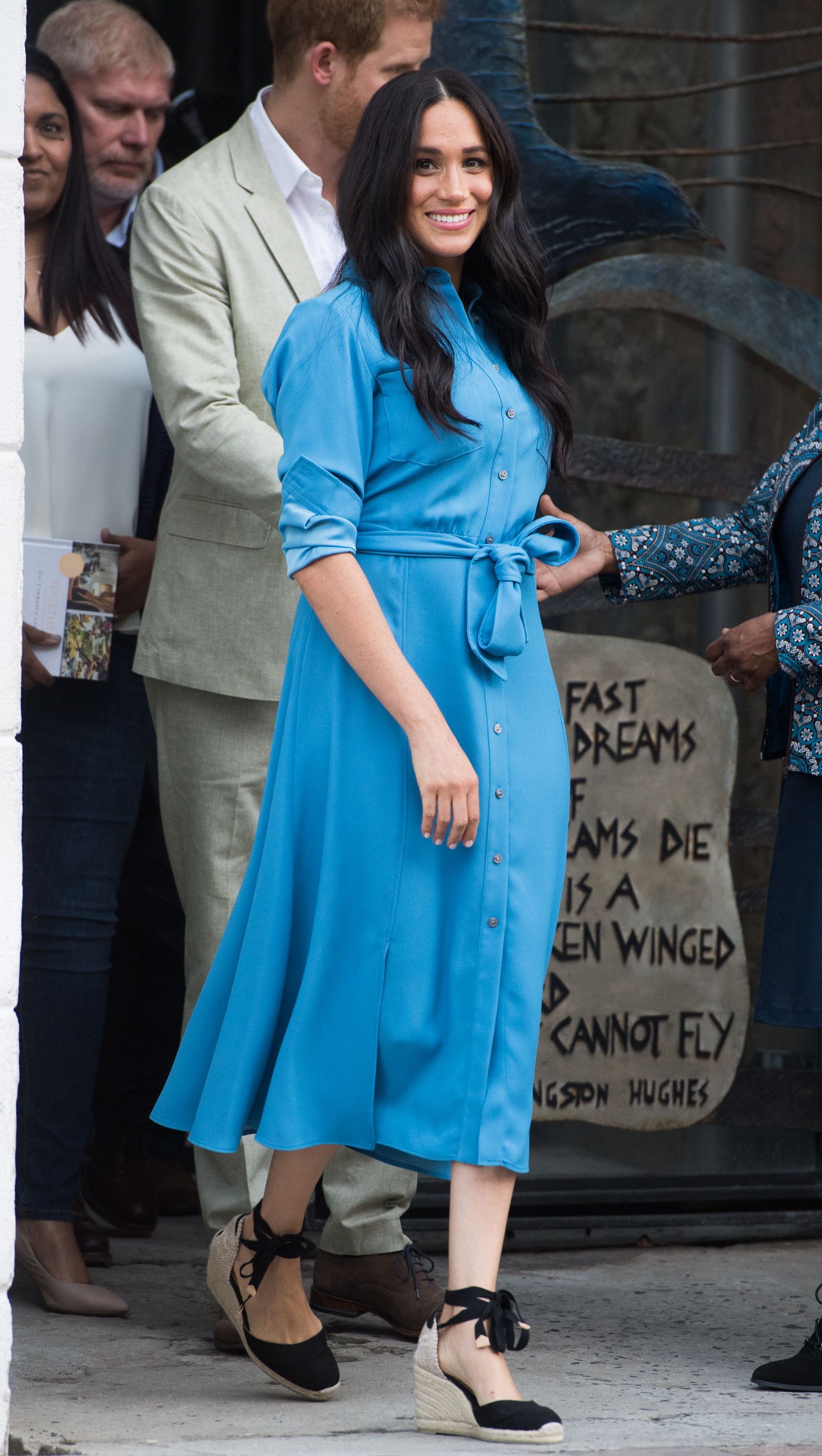 Meghan Markle wearing a blue dress in 2019