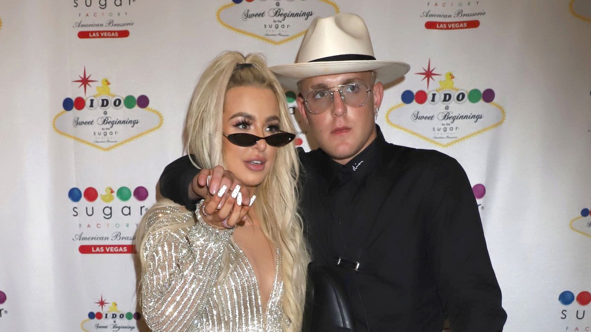 Tana Mongeau and Jake Paul holding hands