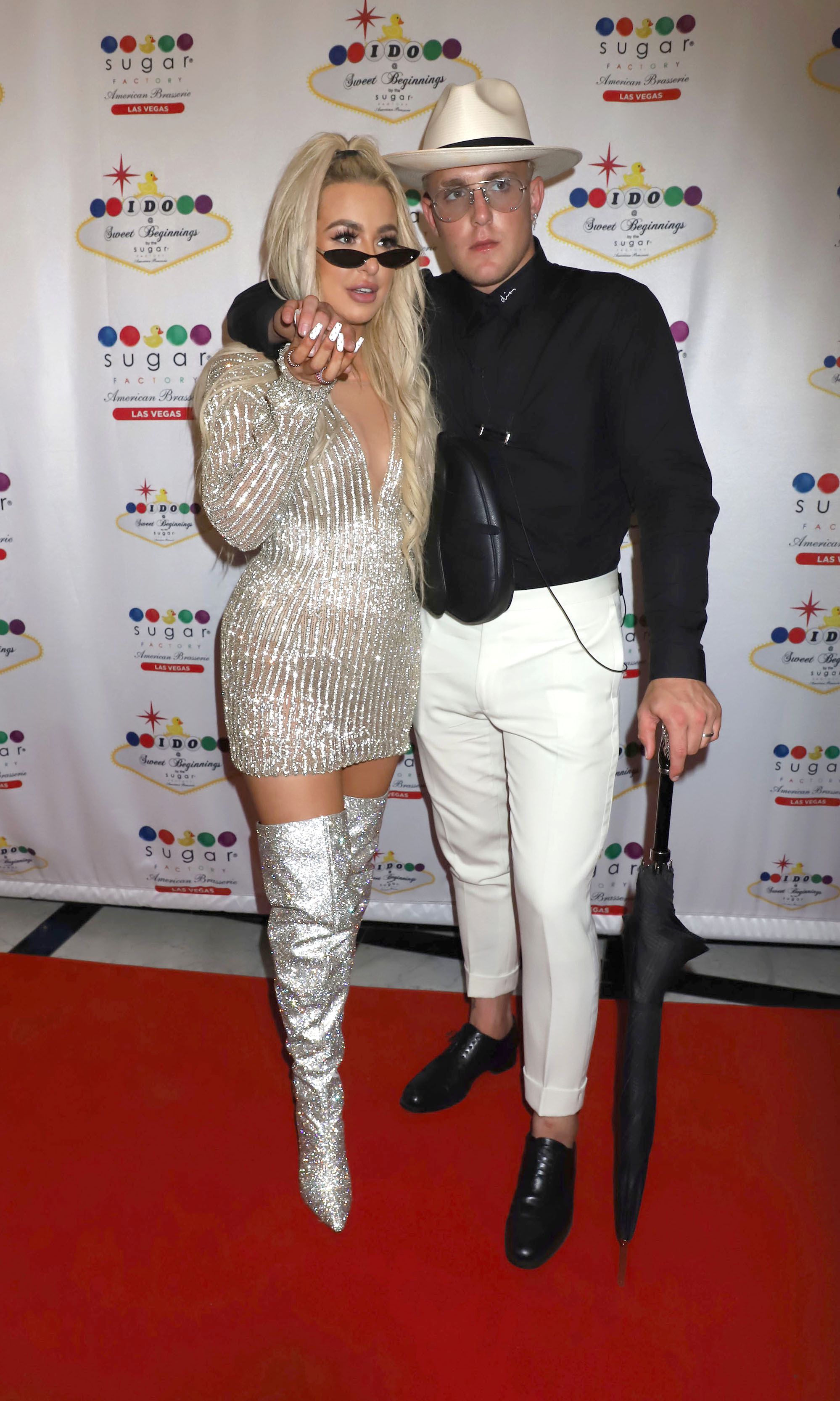 Tana Mongeau and Jake Paul holding hands