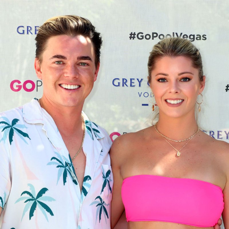jesse mccartney wears a white top and shorts with palm tree print and katie peterson wears a hot pink bikini jesse mccartney katie peterson engaged