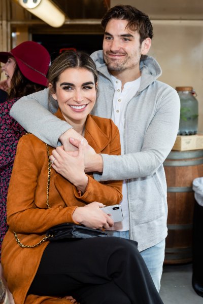 Ashley Iaconetti in Yellow Jacket and Jared Haibon in Grey Sweater Cuddle 