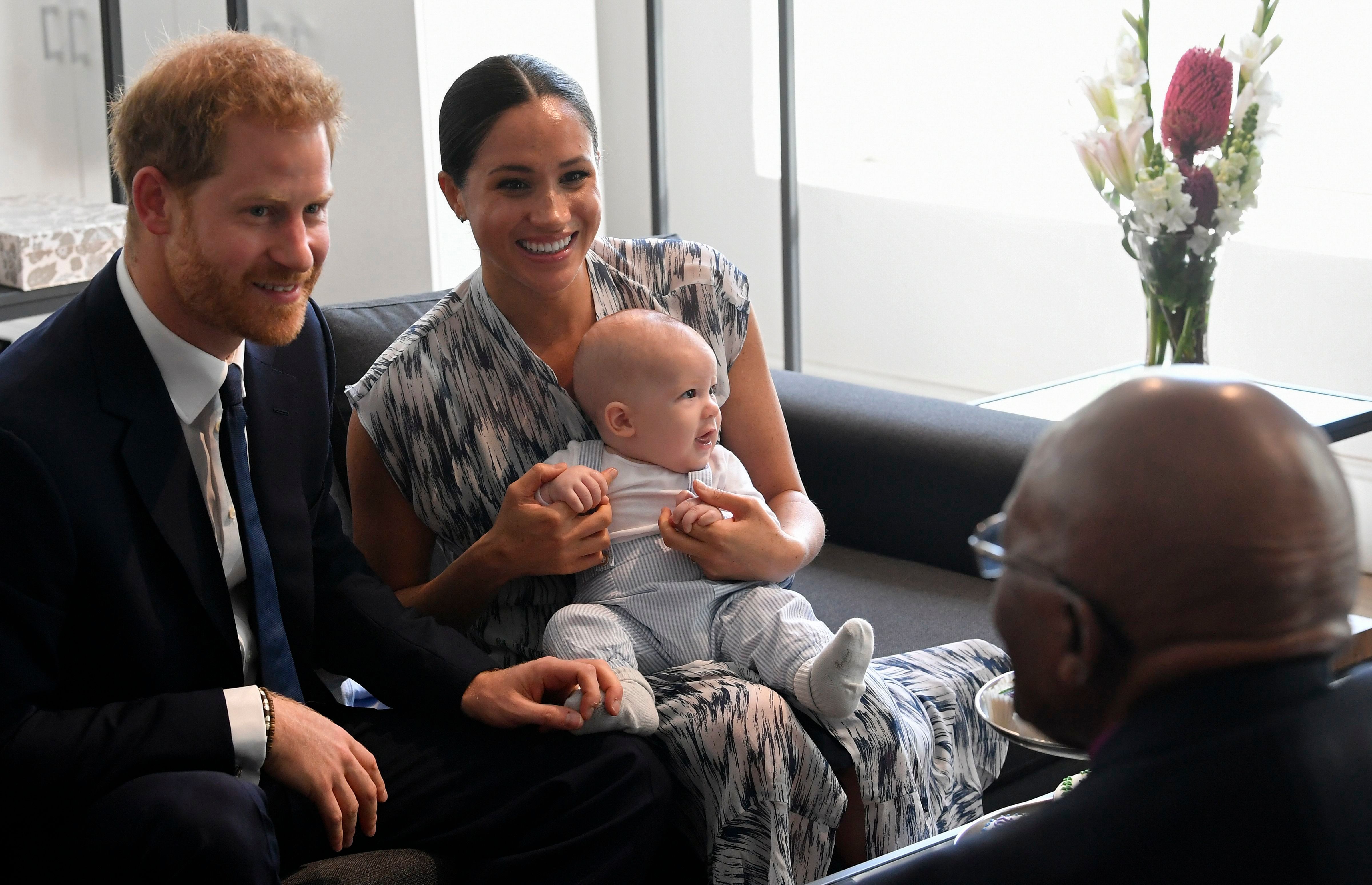 Prince Harry and Meghan Duchess of Sussex and Baby Archie Sit With Desmond Tutu