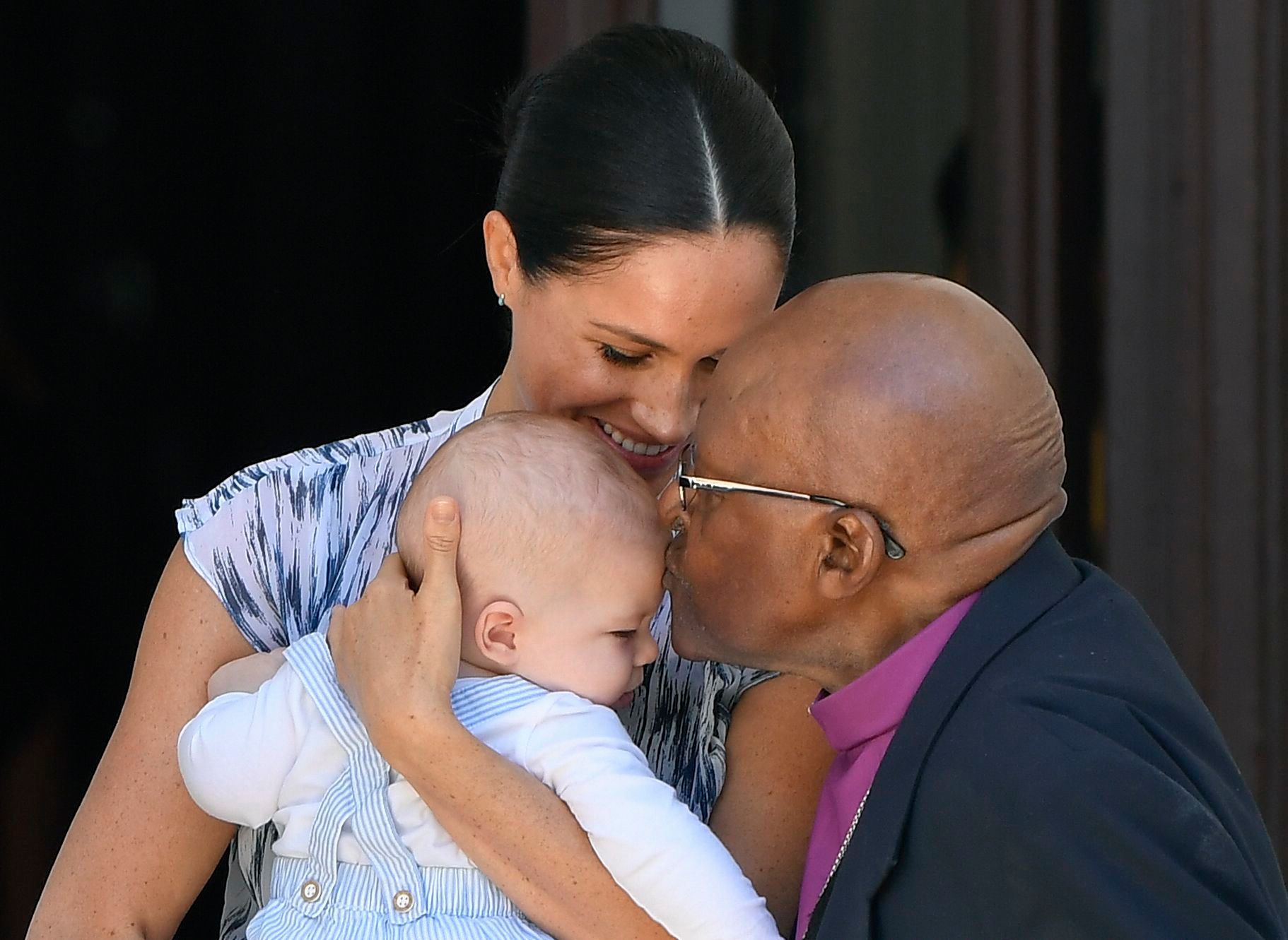 Desmond Tutu Kisses baby Archie on the Head With Meghan Markle