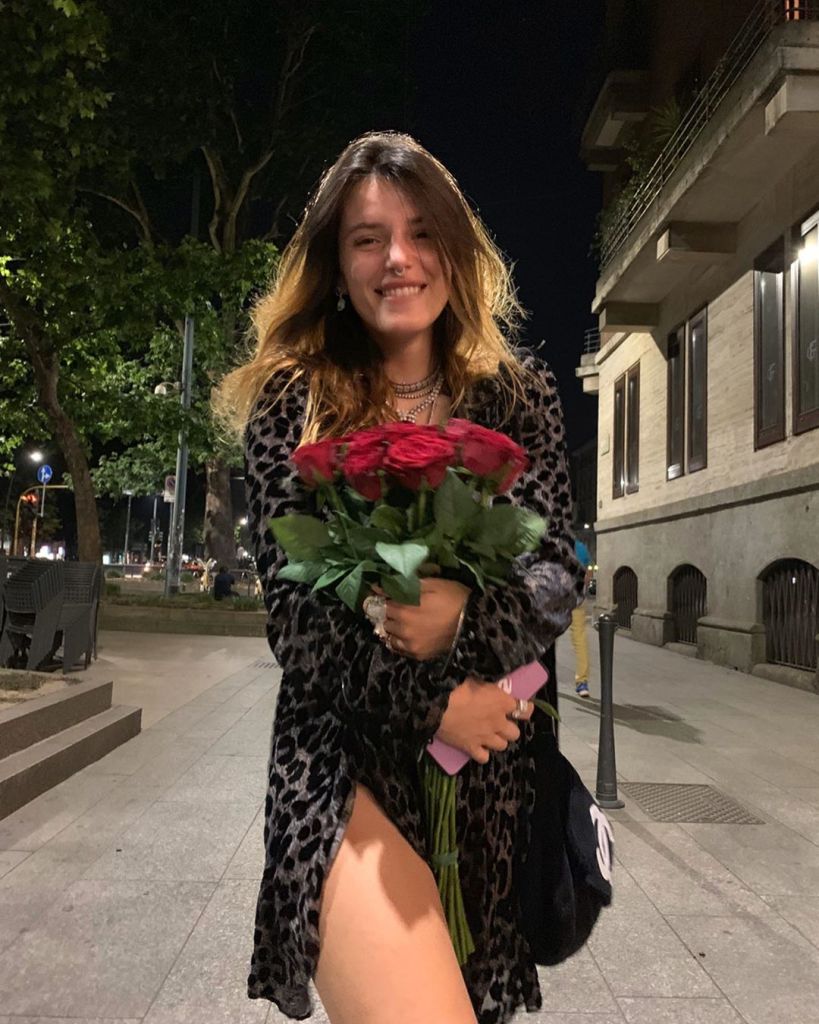 Bella Thorne Holding a Bouquet of Roses