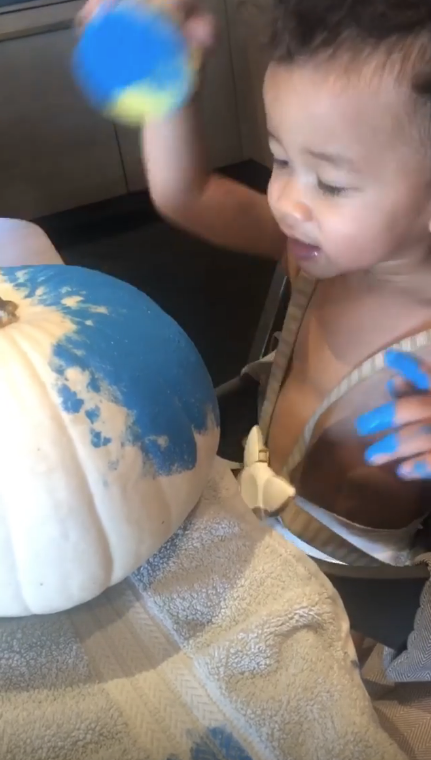 Chrissy Teigen's Son Miles Painting a Pumpkin