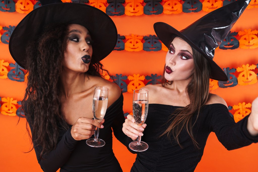 Two Women in Witch Halloween Costumes
