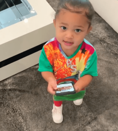 Stormi Webster Wears a Tie-Dye T-Shirt While Listening to Kylie Jenner's Rise and Shine 