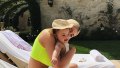 Kylie Jenner Kissing Stormi in Neon Yellow Bikini