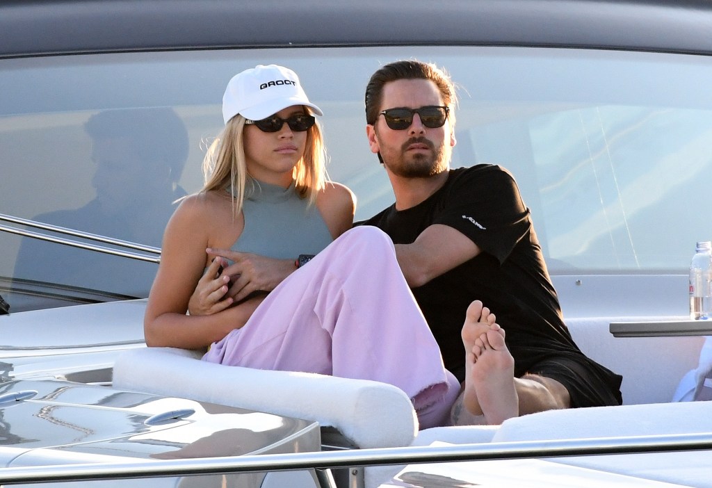 Scott Disick Wearing a Black Shirt With Sofia Richie in a Gray Top and Pink Pants on a Boat in Miami