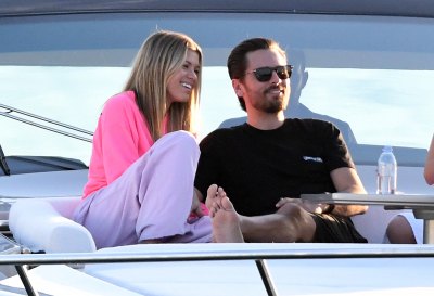Scott Disick Wearing a Black Shirt With Sofia Richie in a Gray Top and Pink Pants on a Boat in Miami