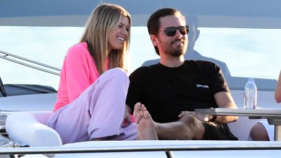 Scott Disick Wearing a Black Shirt With Sofia Richie in a Gray Top and Pink Pants on a Boat in Miami