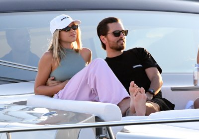 Scott Disick Wearing a Black Shirt With Sofia Richie in a Gray Top and Pink Pants on a Boat in Miami