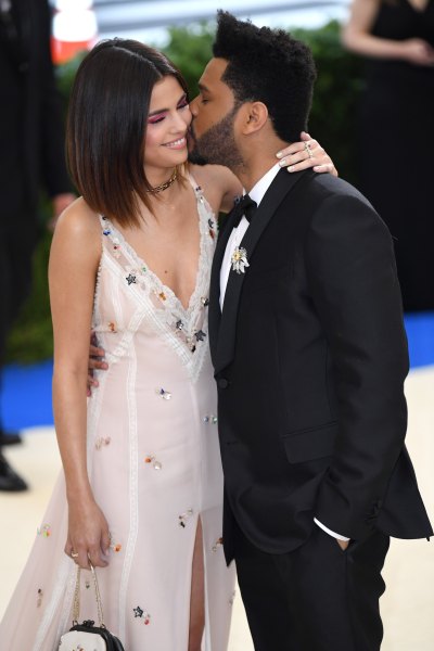 Selena Gomez Wearing a Pink Dress With The Weeknd