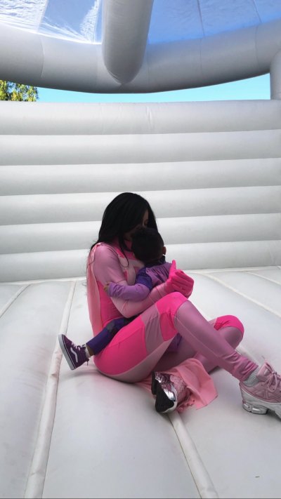 Kylie Jenner Halloween Party Stormi in Bouncehouse Hugging