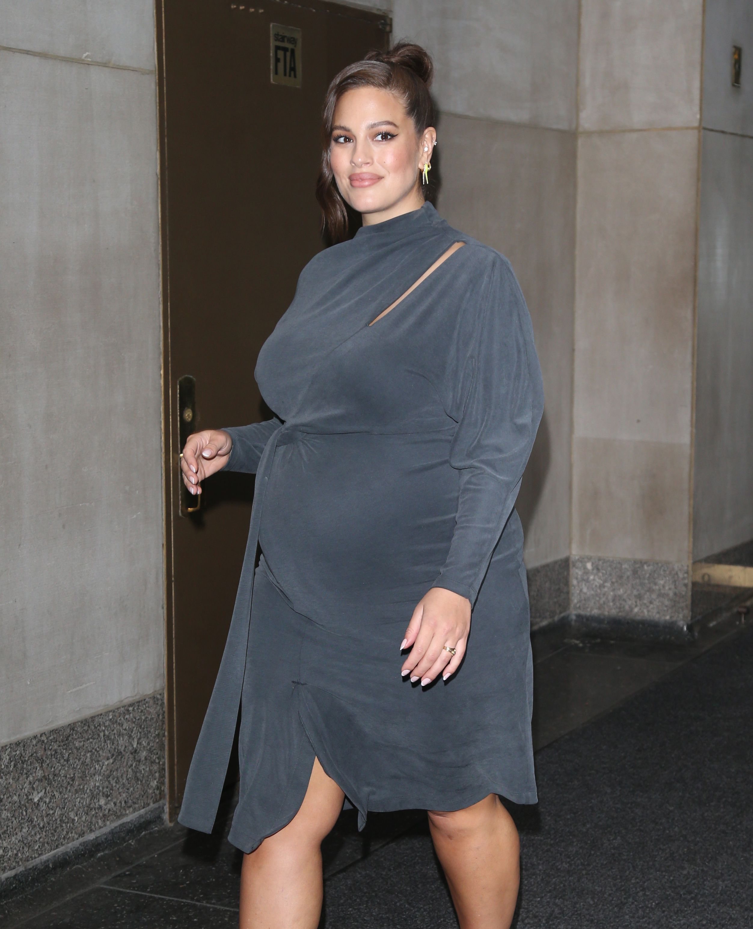 Pregnant Ashley Graham Wearing a Tight, Grey Dress